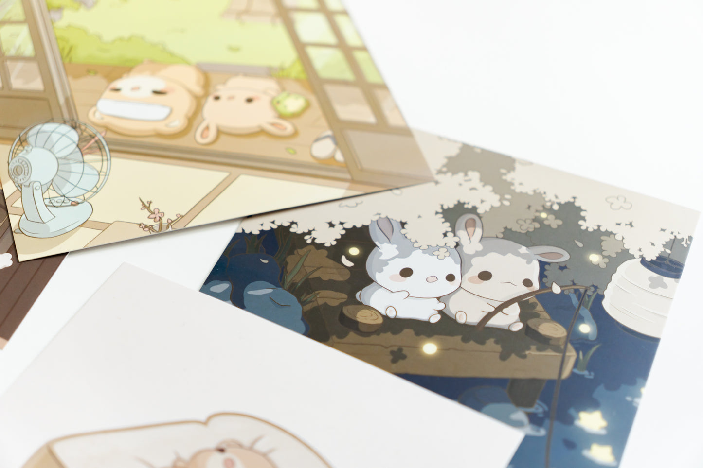 a 5.5"x5.5" square art print featuring two cute bunnies fishing in a sea of stars.