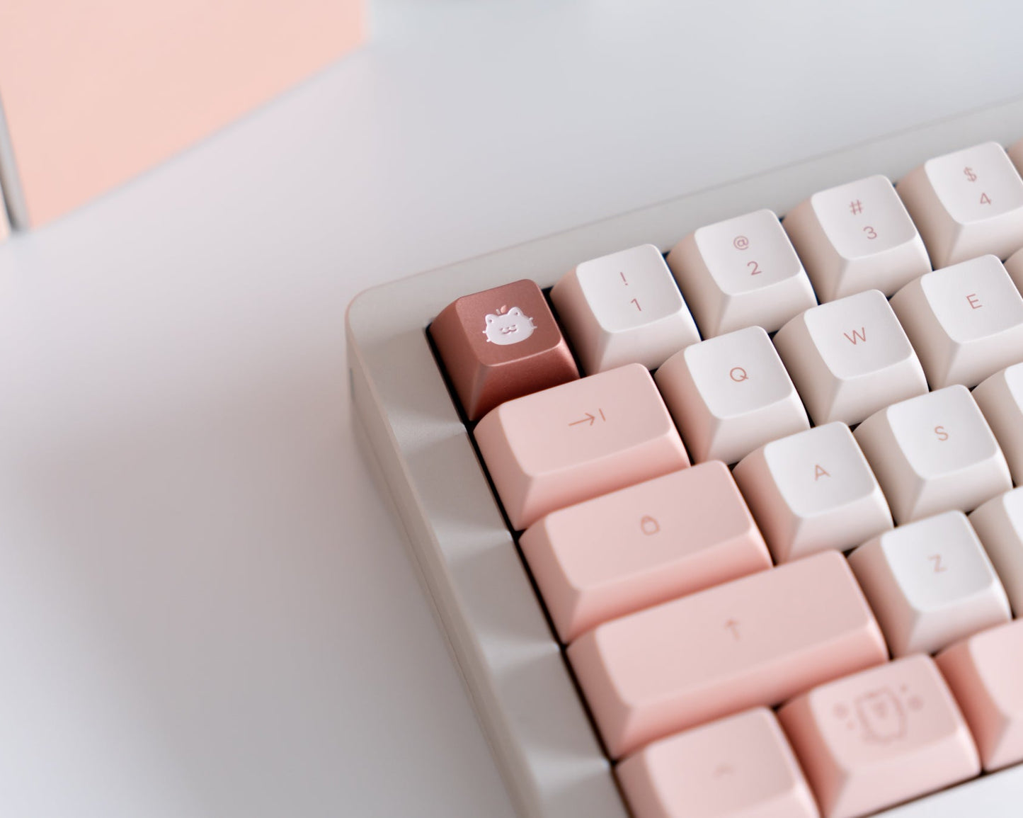 the momo neko metal artisan on a white 60% keyboard.