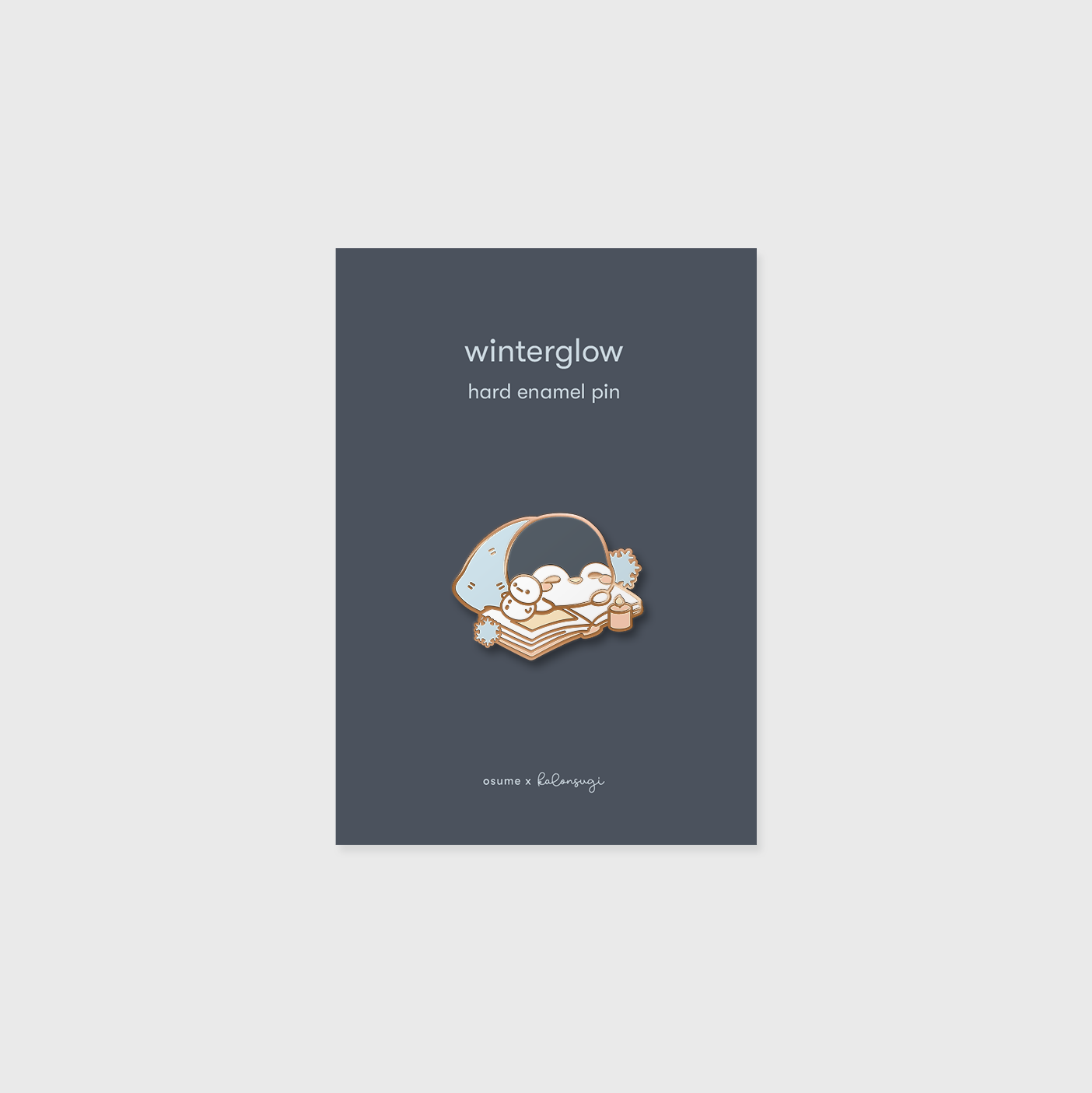 osume's winterglow enamel pin in rose gold featuring a cute sleeping penguin.