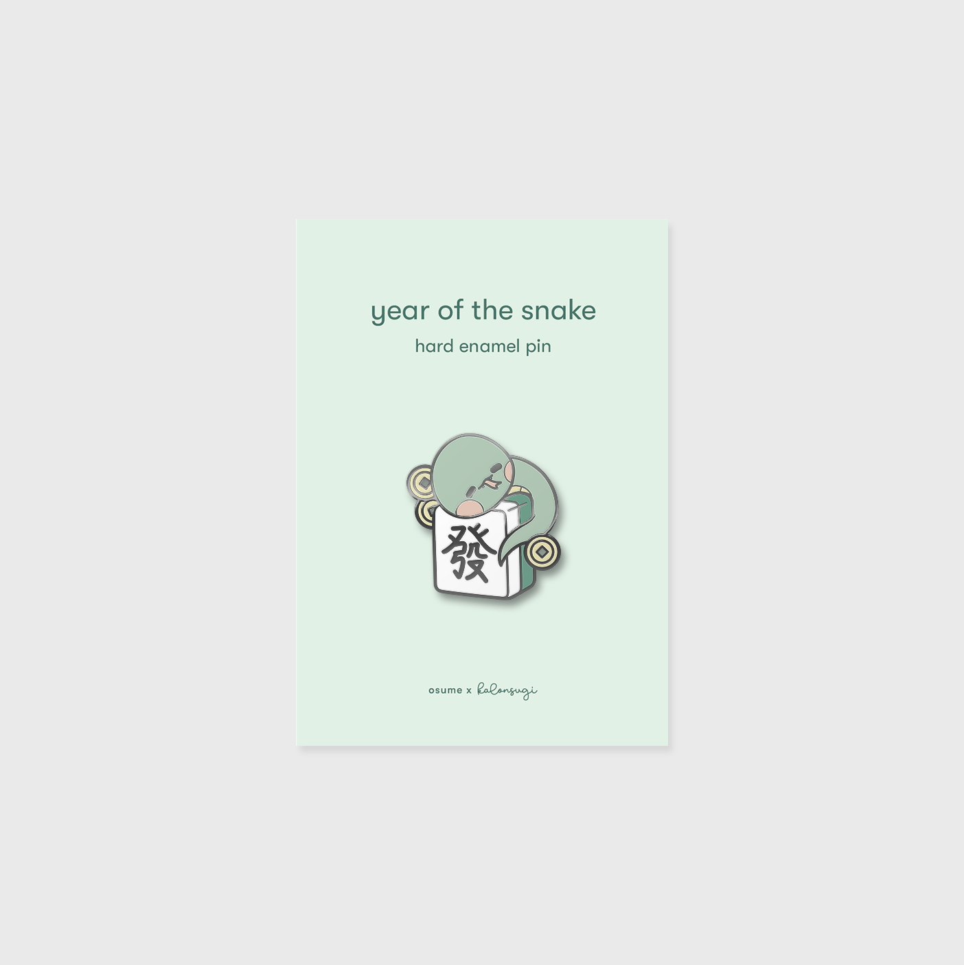 osume's year of the snake enamel pin featuring a cute snake on a mahjong tile.