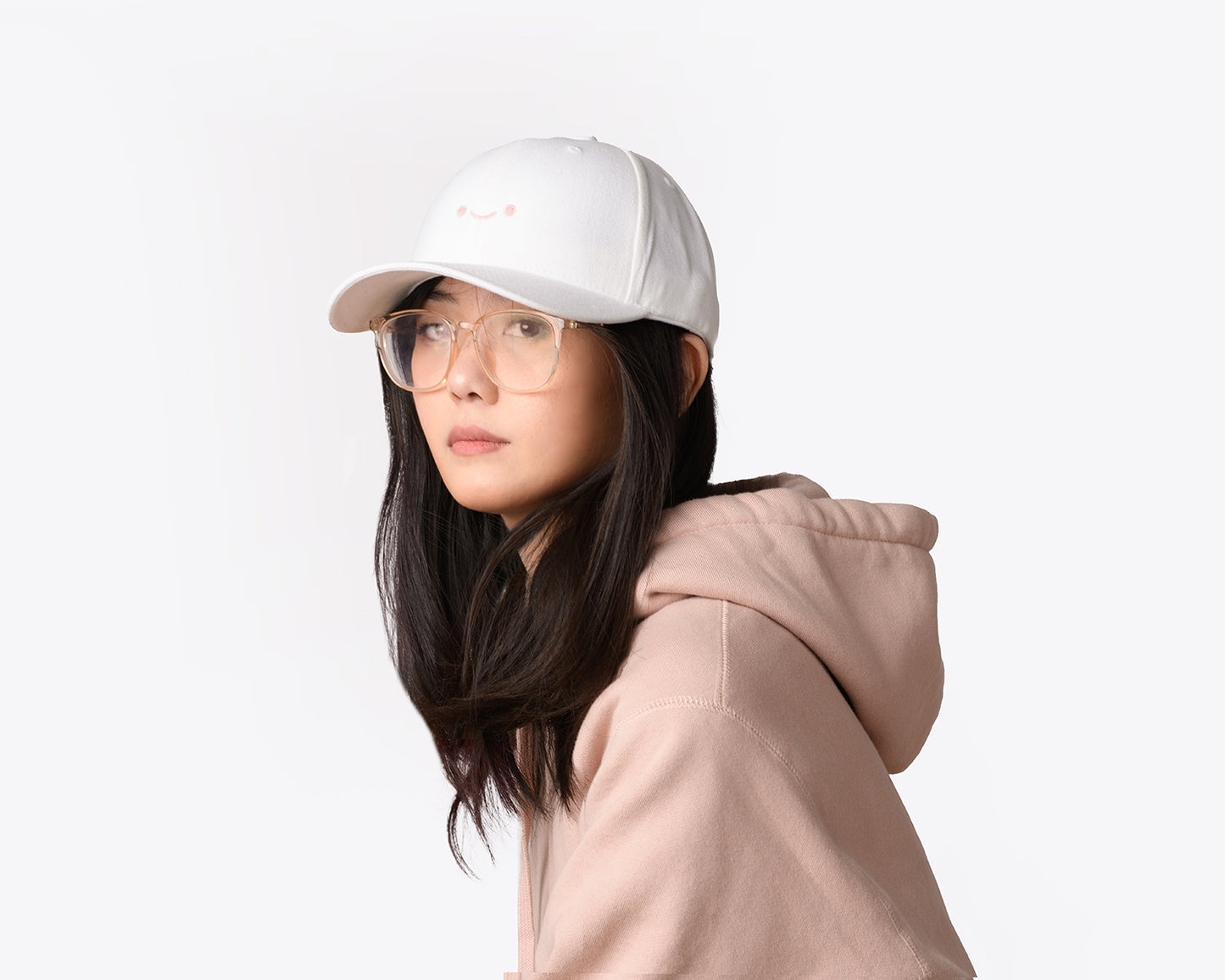 osume’s original soft dad cap in cozy white featuring an embroidered pink smiley face.