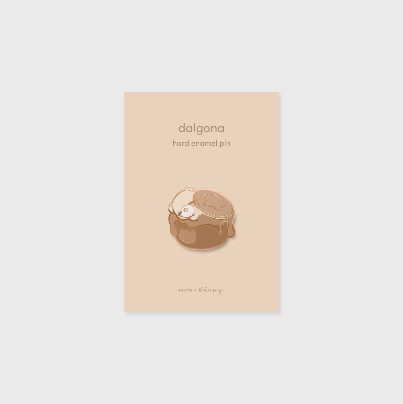 osume's dalgona enamel pin in rose gold featuring a cute bear in dalgona coffee.