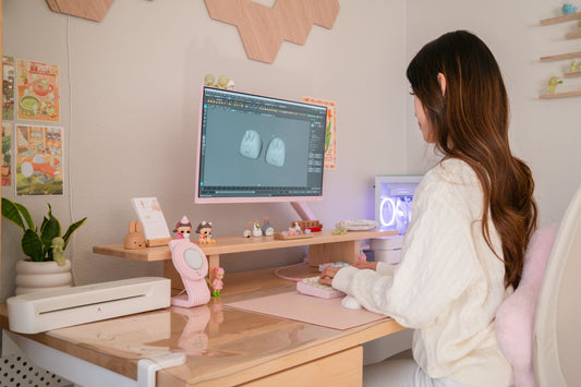 a warm and cute desk setup featuring lavenderbeecaps creating on her computer