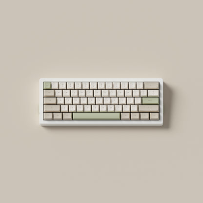 the cafe keycaps, in marshmallow profile, on a white 60% keyboard.