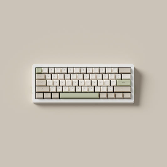 the cafe keycaps, in marshmallow profile, on a white 60% keyboard.