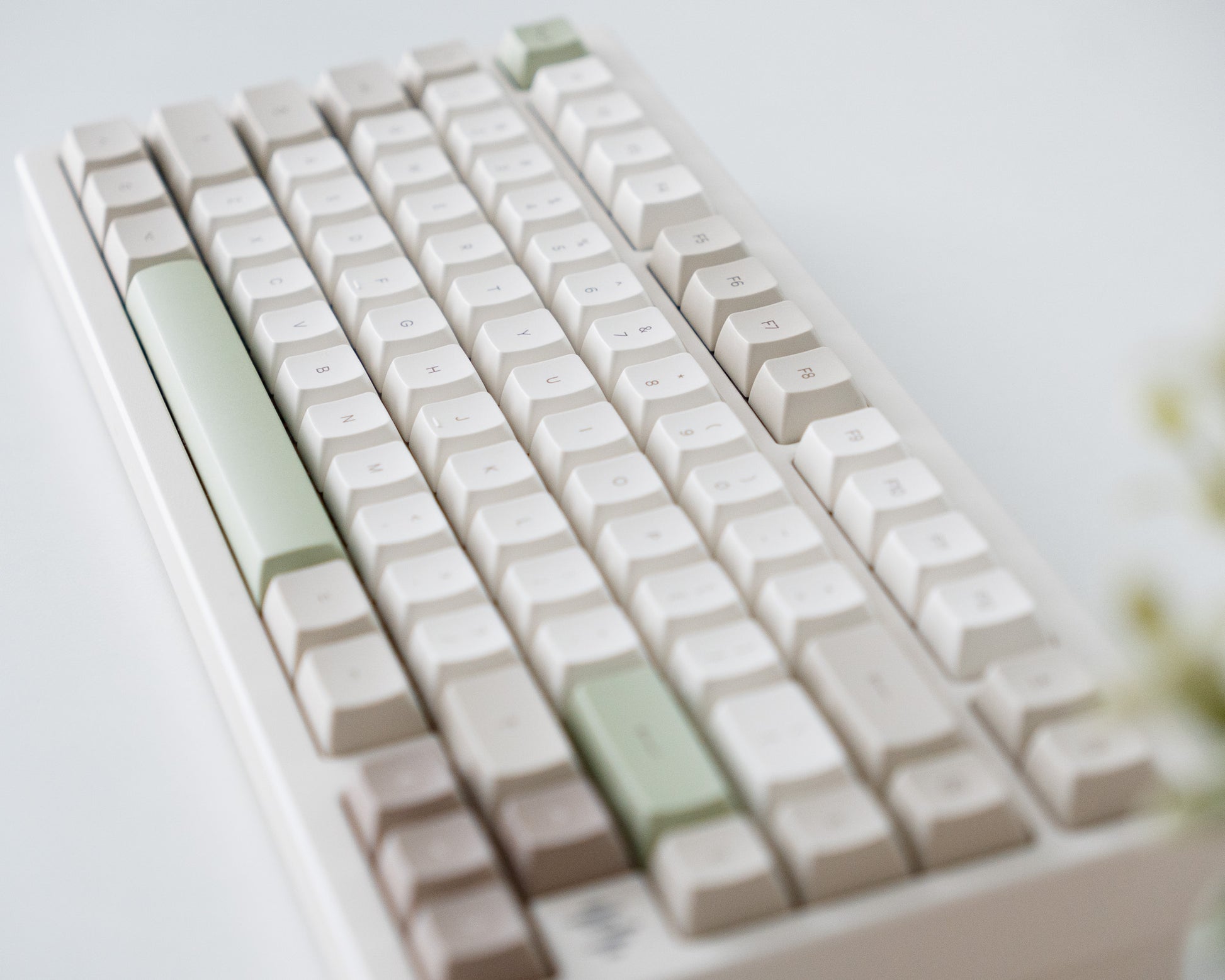 the cafe keycaps in marshmallow profile on a white desk setup.