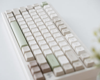 the cafe keycaps in marshmallow profile on a white desk setup.