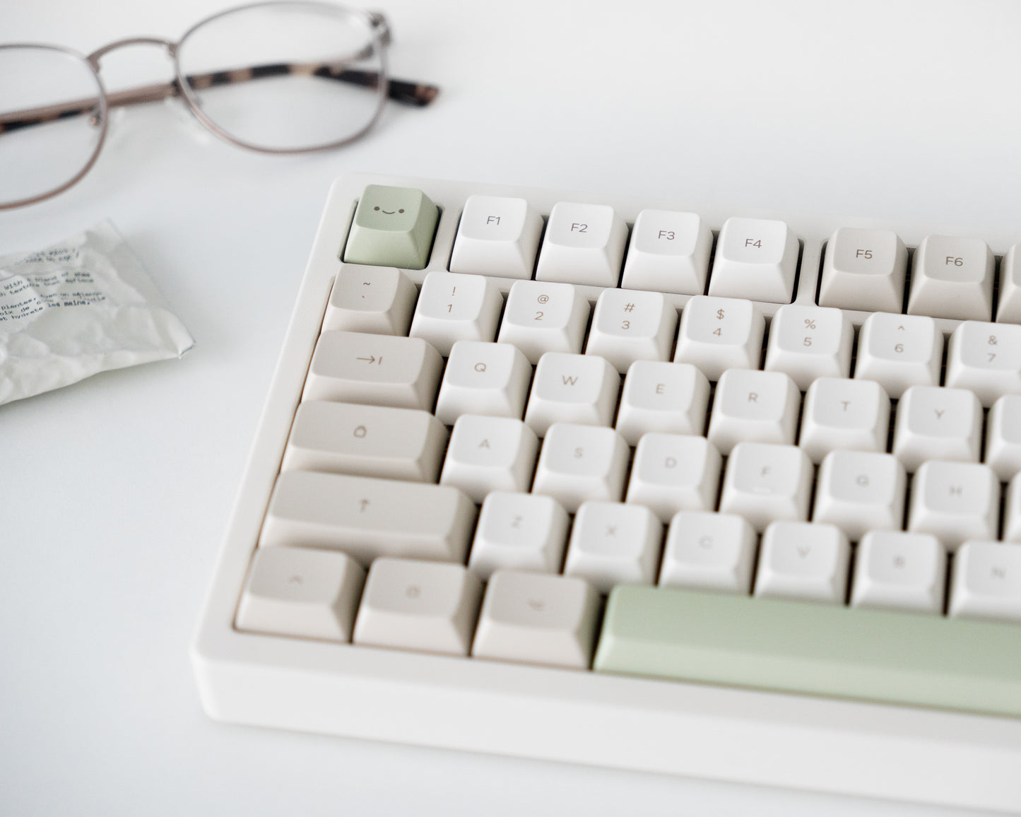 the cafe keycaps in marshmallow profile on a white desk setup.