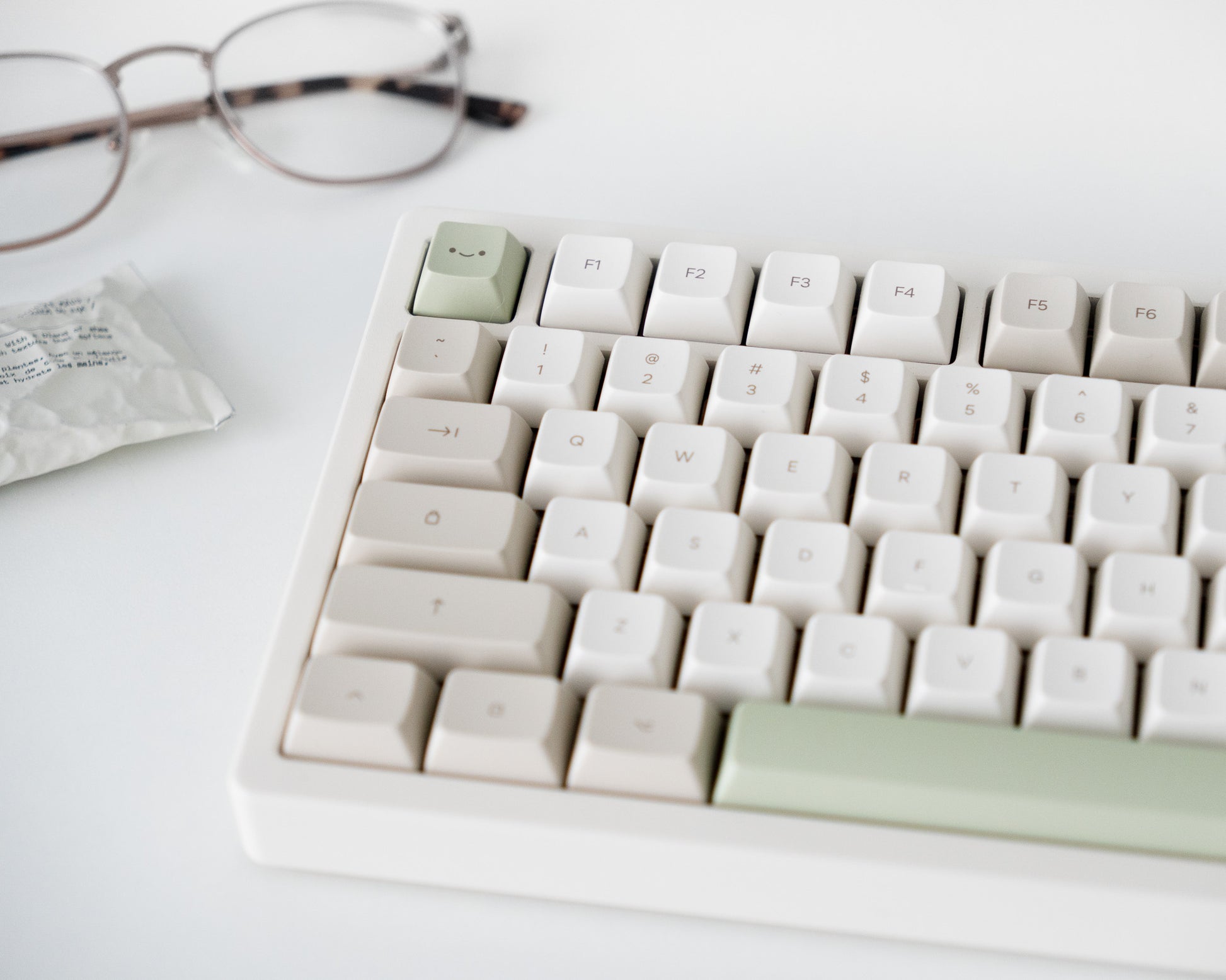 the cafe keycaps in marshmallow profile on a white desk setup.