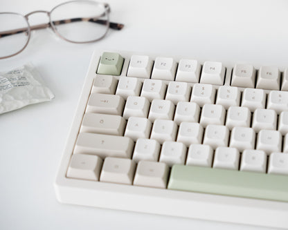 the cafe keycaps in marshmallow profile on a white desk setup.