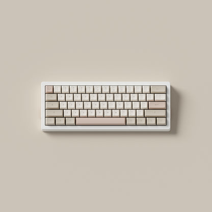 the cafe rose keycaps, in marshmallow profile, on a white 60% keyboard.