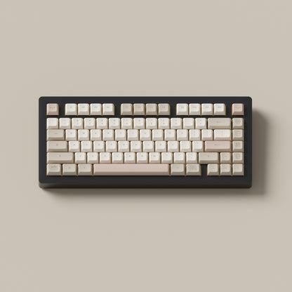 the cafe rose marshmallow keycaps with matching novelty keys on a black 75% keyboard.