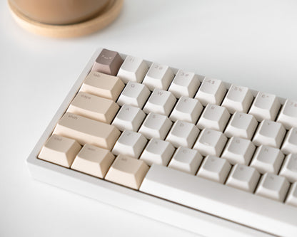 the standard dalgona keycaps, in cherry profile, on a white 60% keyboard.