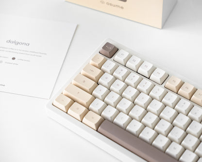 the dalgona keycaps in marshmallow profile on a white desk setup.
