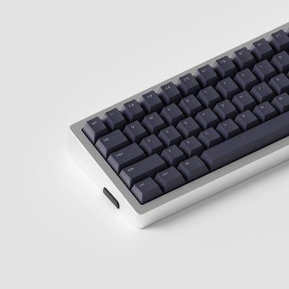 the standard horoscope keycaps, in cherry profile, on a silver 60% keyboard.