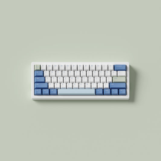 the standard konbini green keycaps, in cherry profile, on a white 60% keyboard.