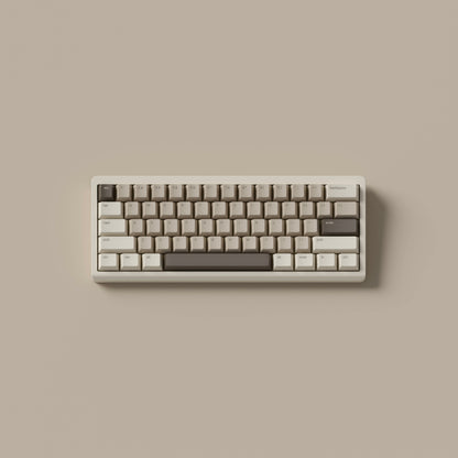 the mocha keycaps, in cherry profile, on a cream 60% keyboard.