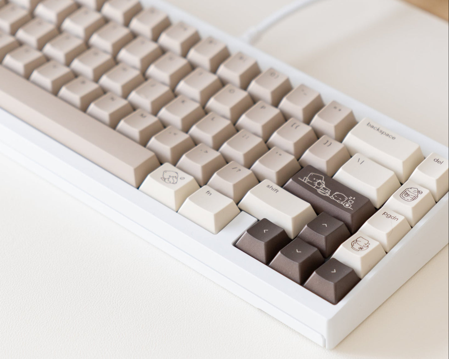 the mocha keycaps, in cherry profile, on a white 60% keyboard.