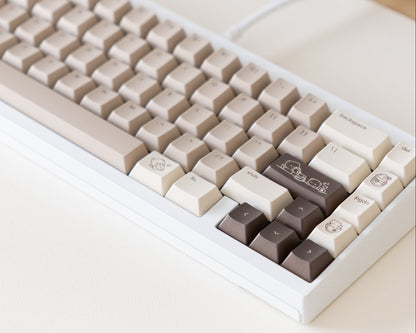 the mocha keycaps, in cherry profile, on a white 60% keyboard.