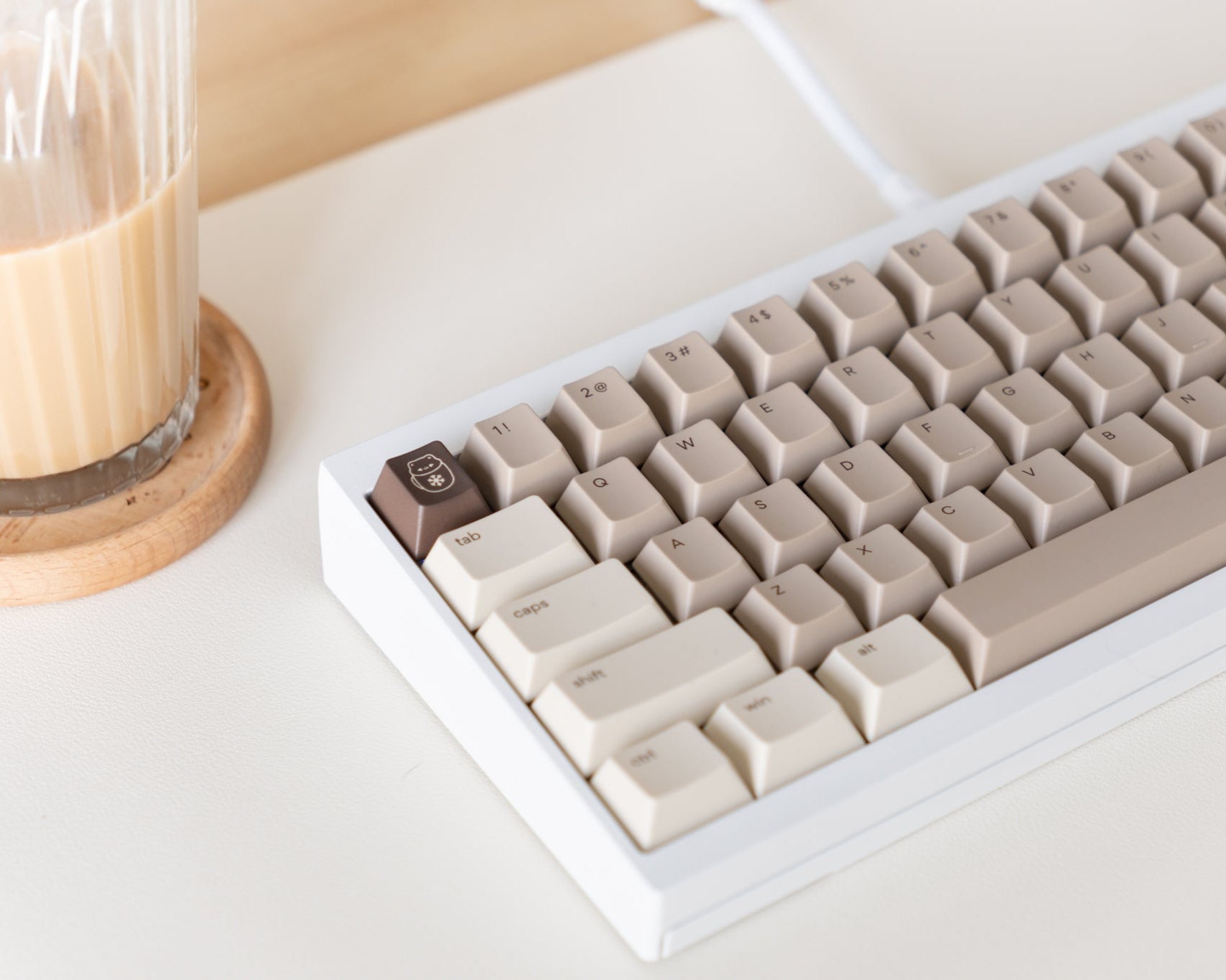 the mocha keycaps, in cherry profile, on a white 60% keyboard.