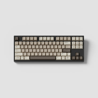 the standard mocha keycaps, with mocha novelty keys, on a brown TKL keyboard.
