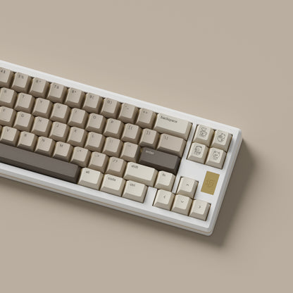 the mocha keycaps, with mocha novelty keys, on a white 68% keyboard.