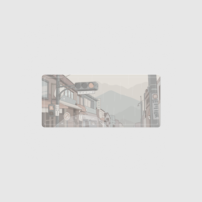 the 70x30cm special edition rainy day city desk mat with edge-stitched trim.