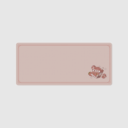 the 90x40cm strawberry milk desk mat with edge-stitched trim.
