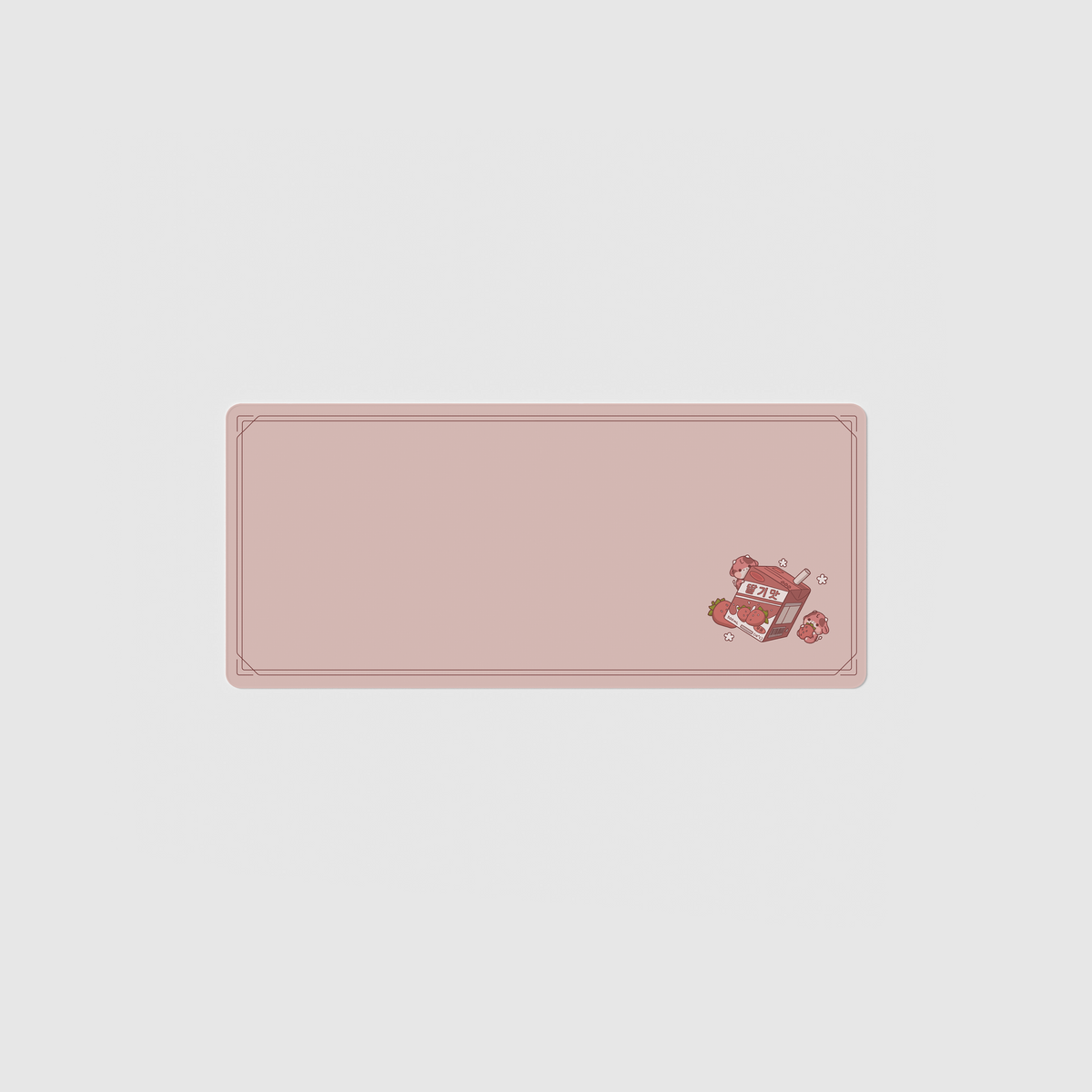 the 70x30cm strawberry milk desk mat with edge-stitched trim.
