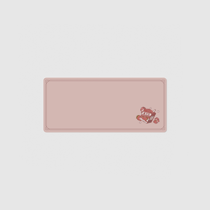 the 70x30cm strawberry milk desk mat with edge-stitched trim.