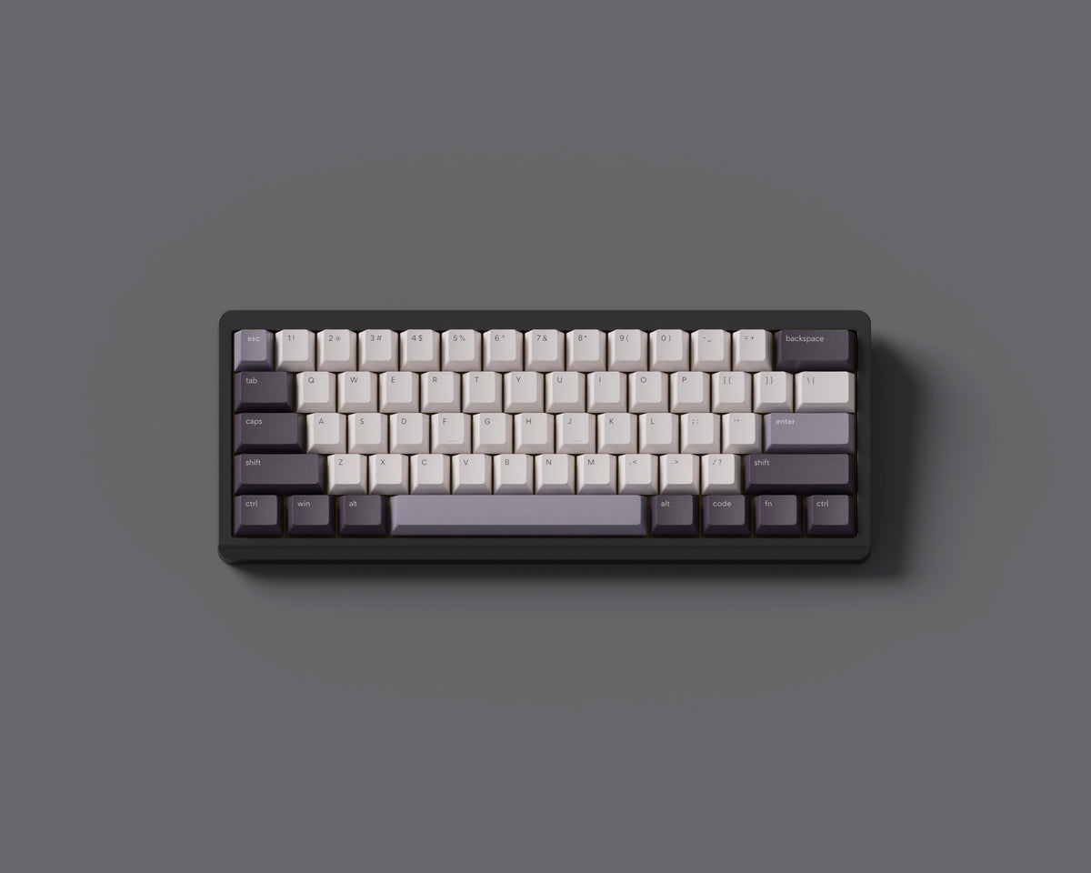 the dusk keycaps, in cherry profile, with purple accents on a black 60% keyboard.